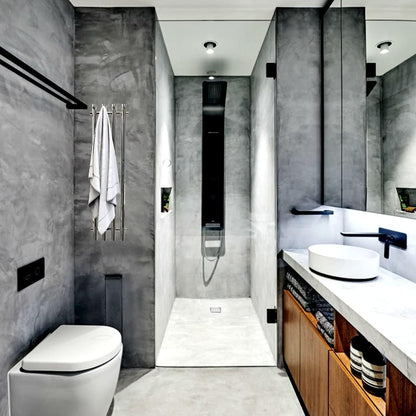 Silver luxury 4-bar towel warmer mounted in modern bathroom near shower and vanity
